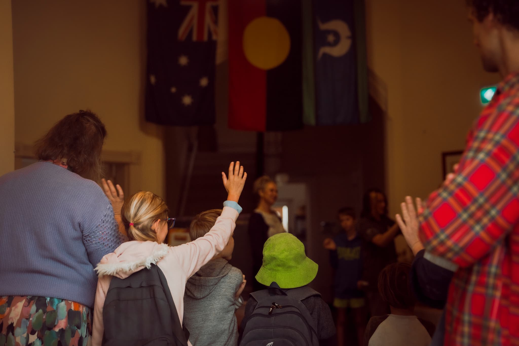 School assembly with Australian and Aboriginal flags
