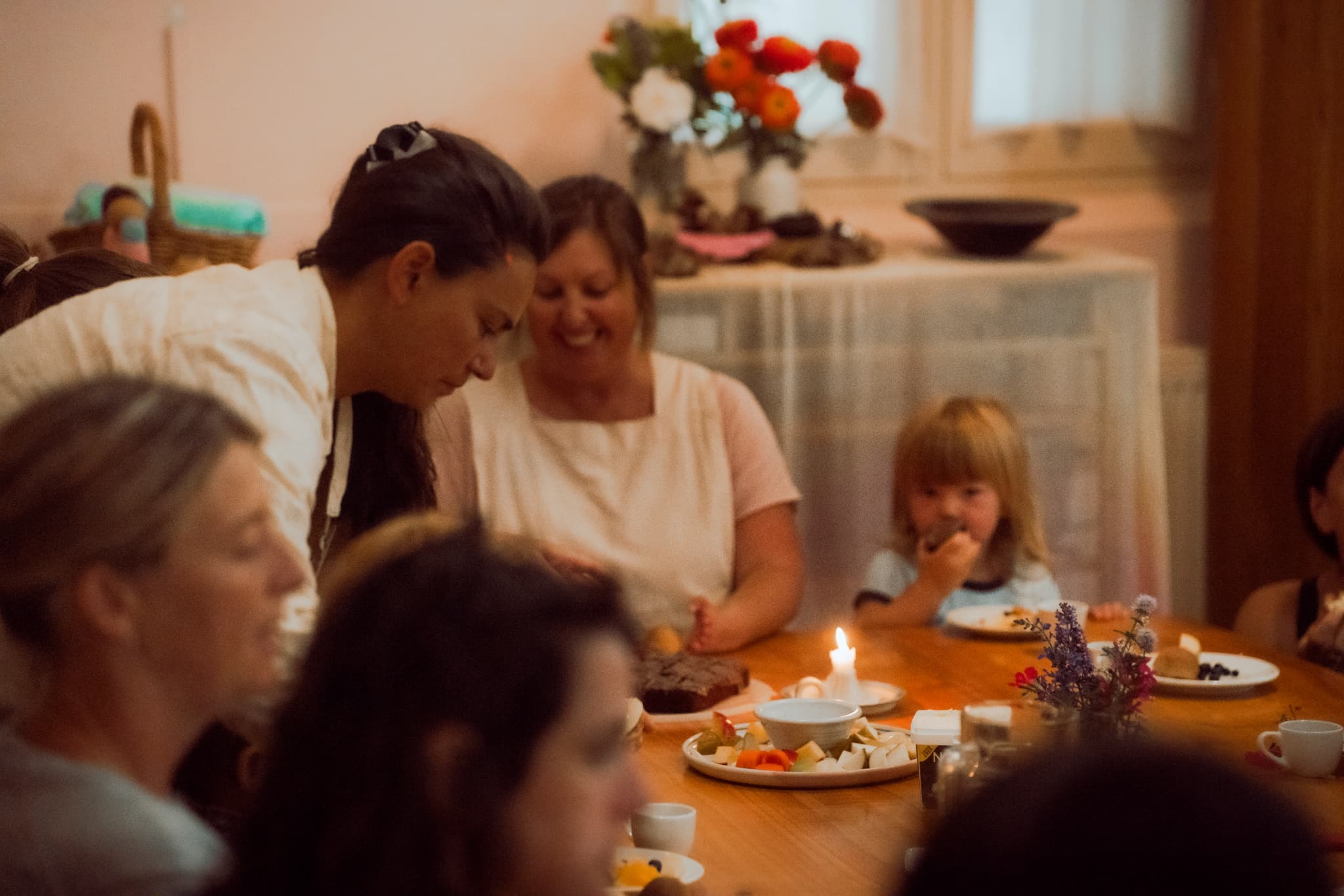 Candlelit shared meal with fresh flowers