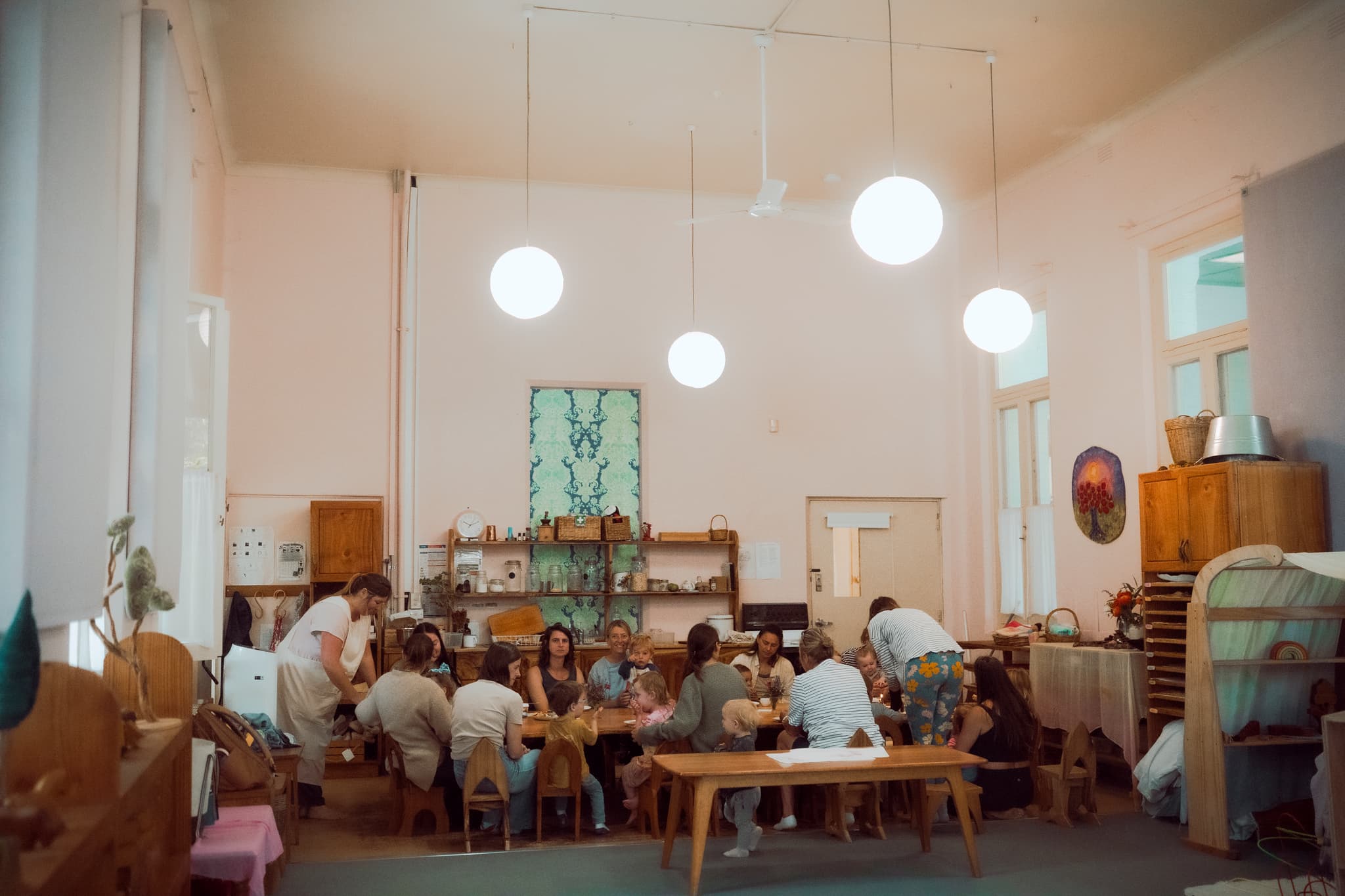 Parents and children sharing a community meal