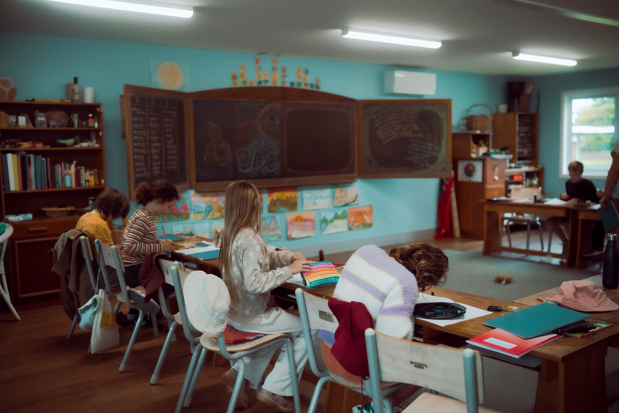 Older students' classroom with duck-egg blue walls