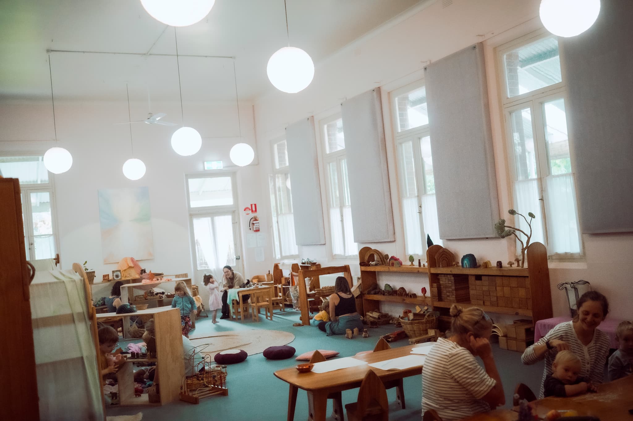 Kindergarten play with natural toys and high ceilings
