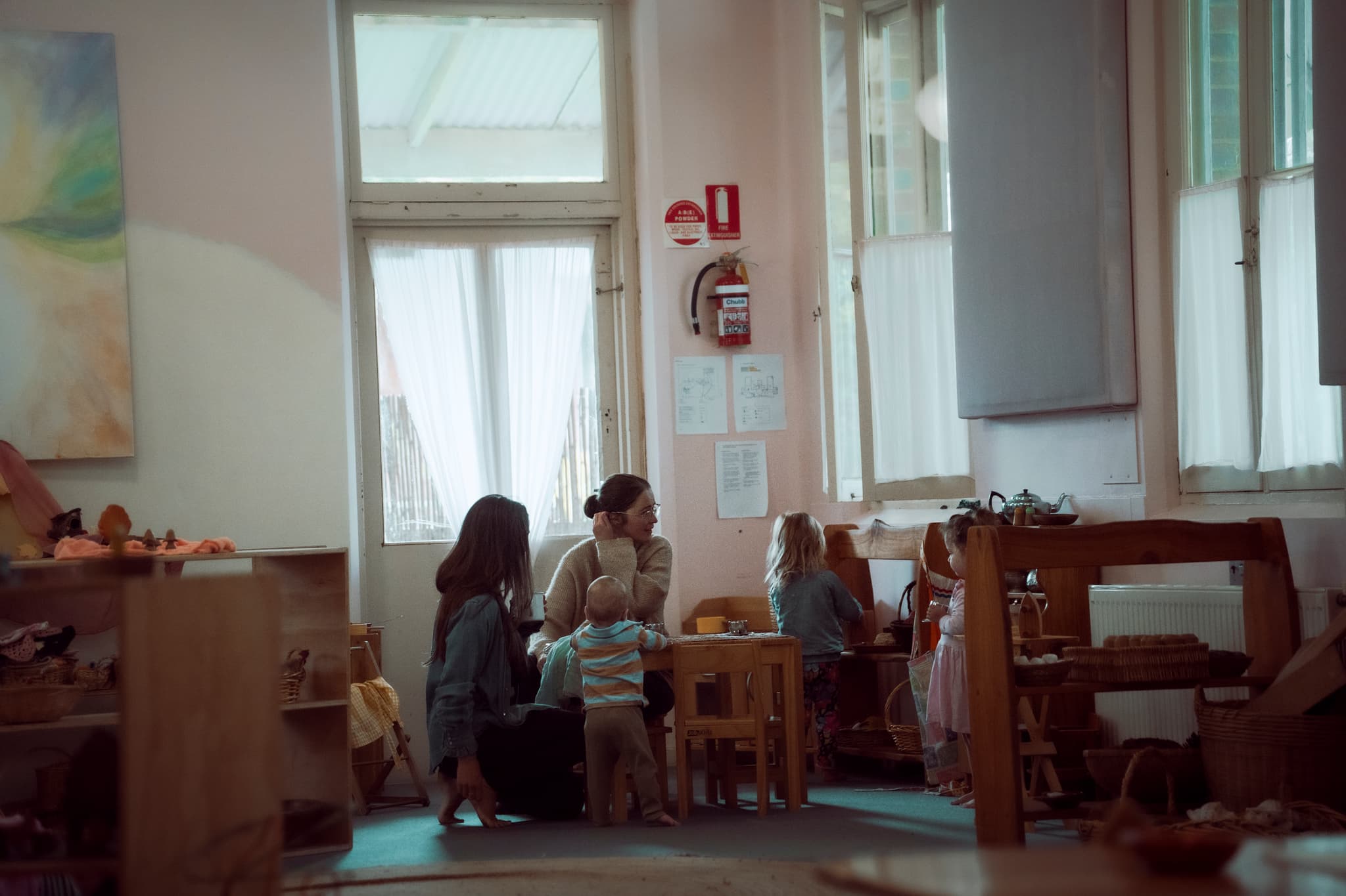 The warm kindergarten room with pink-washed walls